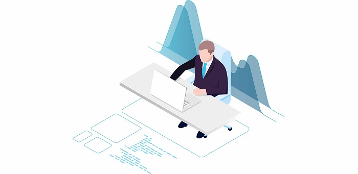 A man sitting and working on his laptop